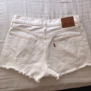 White Levi’s 501 shorts.